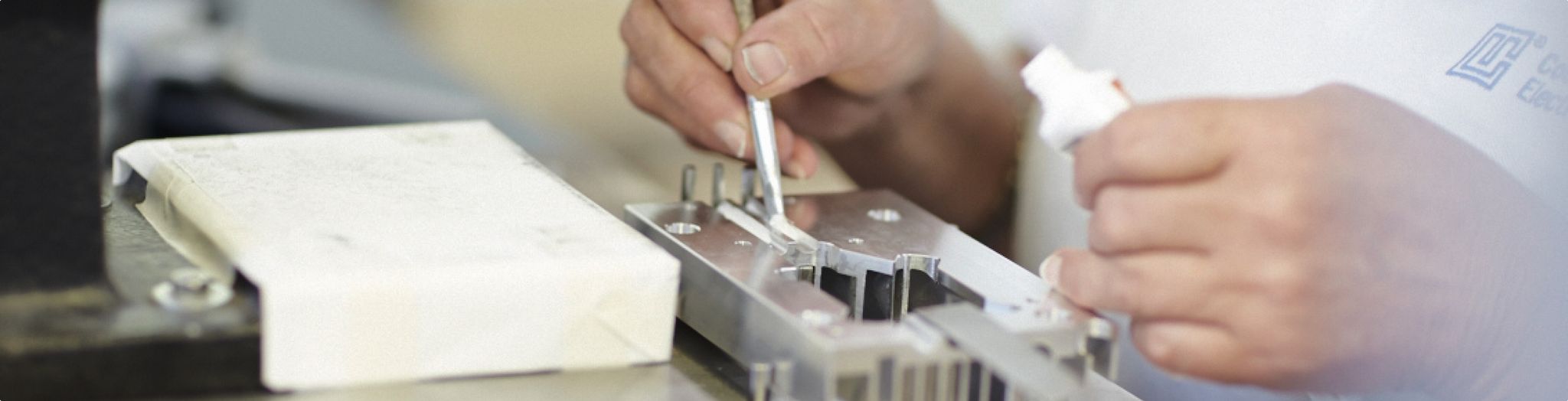 apply component adhesive in recesses for pipe paths
